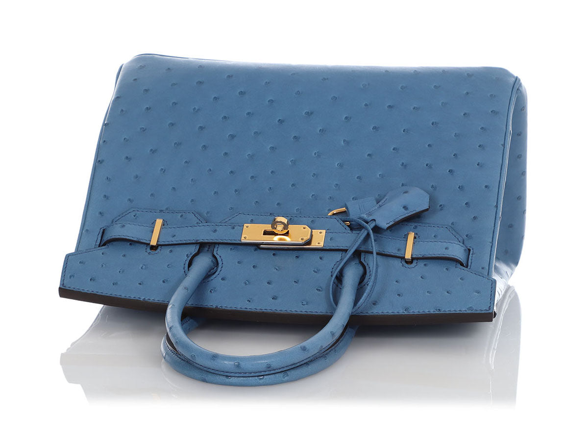 A BLUE ROI OSTRICH CONSTANCE SMALL WALLET WITH GOLD HARDWARE